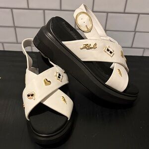 Karl Lagerfeld White and Black Platform Cross-Strap Sandals with Gold Charms